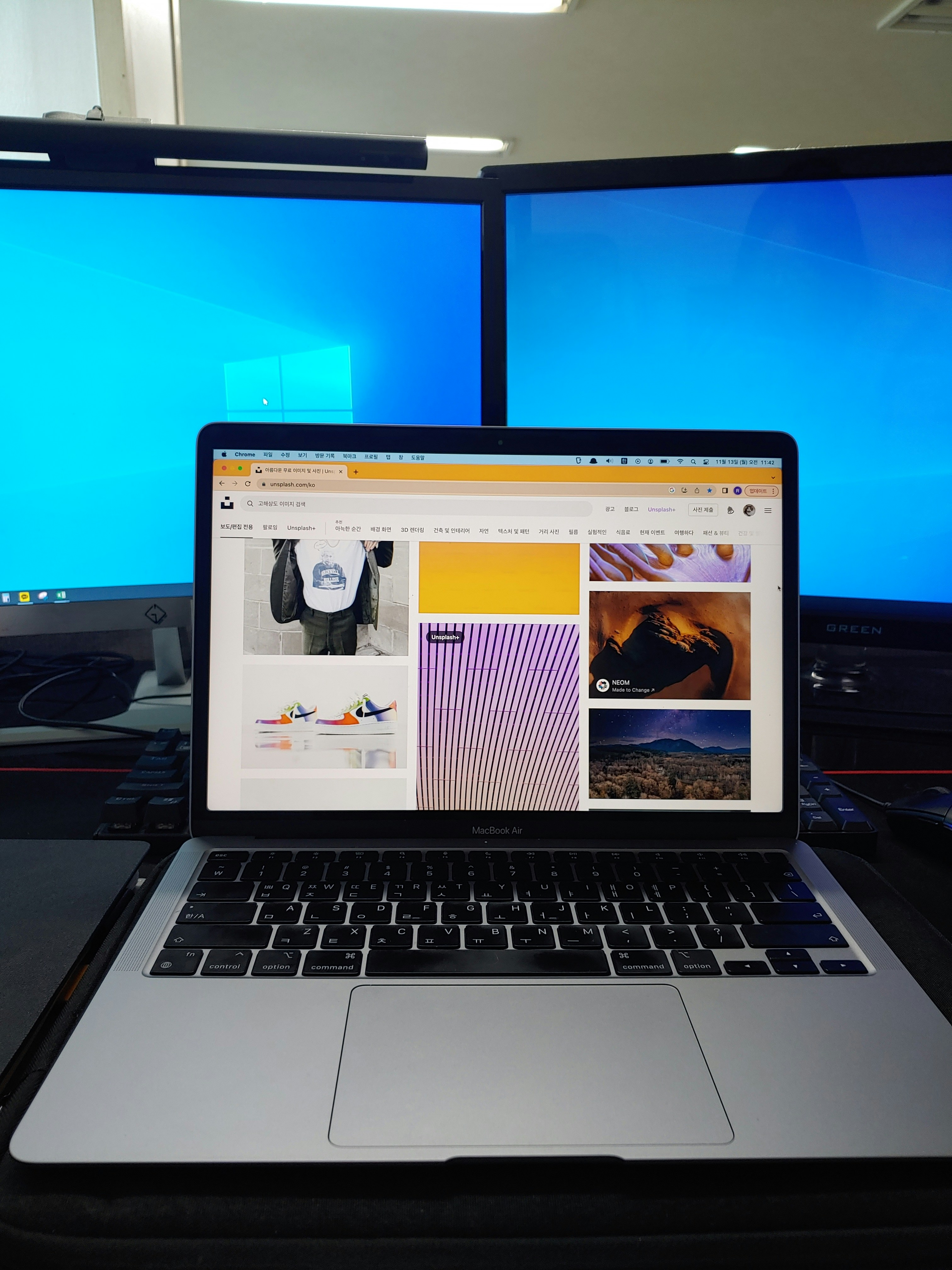 Modern web development workspace with multiple screens showing beautiful websites